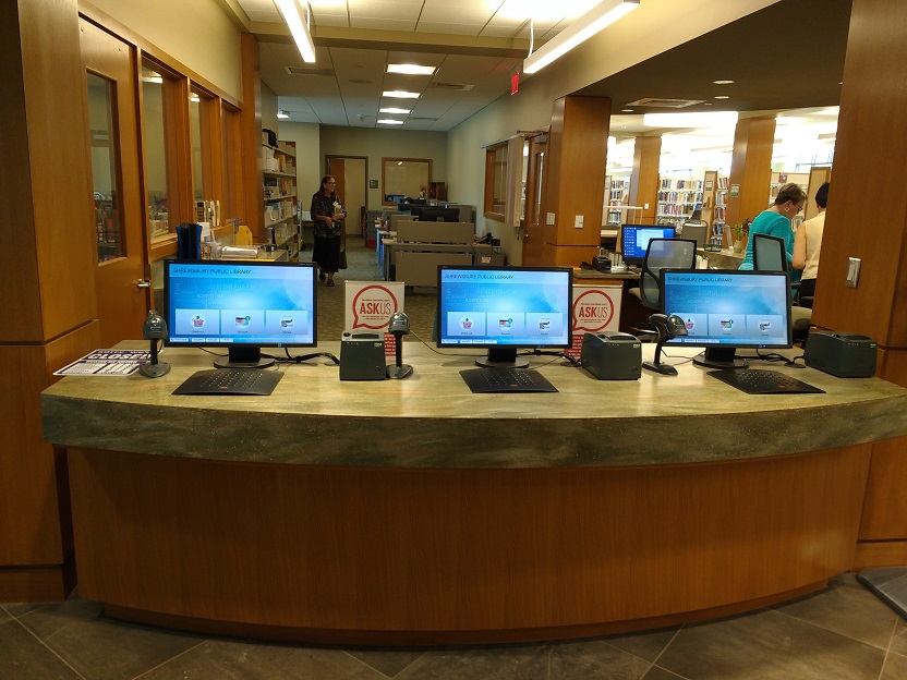 new self checkout machines at the Shrewbury Public Library circulation desk