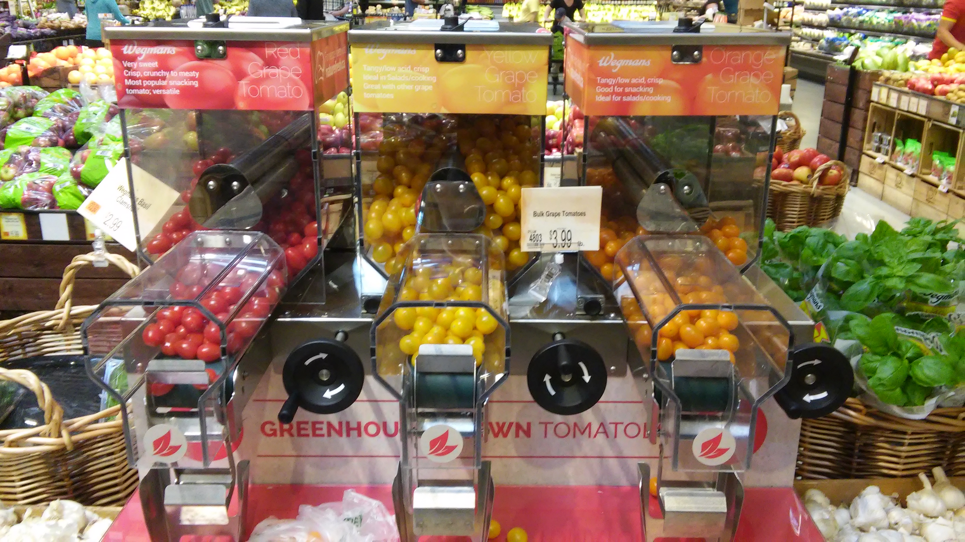 gumball machine style dispensers for tomatoes at Wegmans