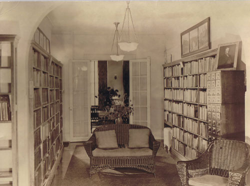main library room near front desk, filled with stacks